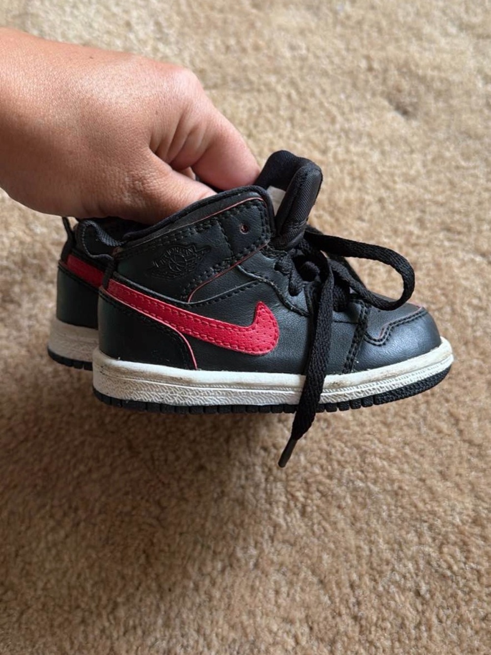 Nike Kids Black Sneakers with Red Swoosh